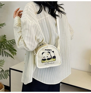 Mini canvas crossbody bag featuring cute cartoon panda print and adjustable strap
