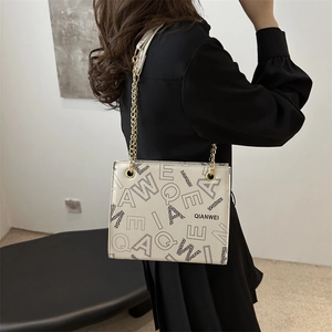 French retro tote bag with letter print and gold chain strap for women in beige
