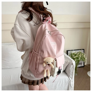 Pink toddler backpack featuring cute teddy bear decor and side water bottle pocket