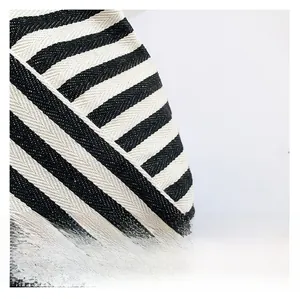 Detail shot of heavy-duty black and white striped canvas fabric with herringbone weave pattern