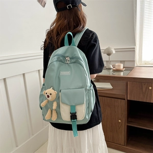 Mint green waterproof nylon student backpack with cute bear charm and fashion label