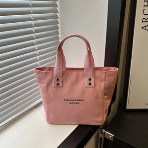 Grand sac cabas en toile rose pour femme avec lettrage tendance et rivets