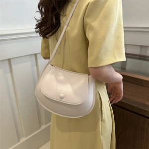 Chic beige half-moon saddle bag with flap closure and chain strap for summer style