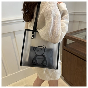 Detail of transparent tote bag with black cartoon bear print and inner pouch