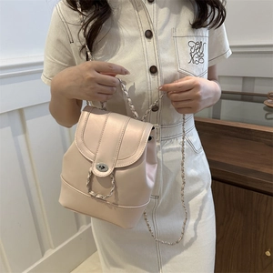 Chic light pink mini faux leather backpack with chain strap and gold twist lock closure