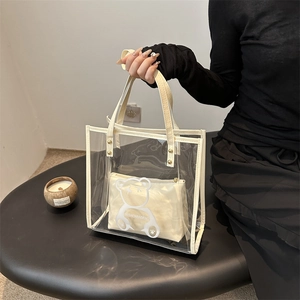 Modern transparent PVC tote bag with teddy bear print inner pouch and leather handles