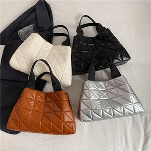 Quilted tote bags in white, black, brown, and silver with stylish lattice stitching