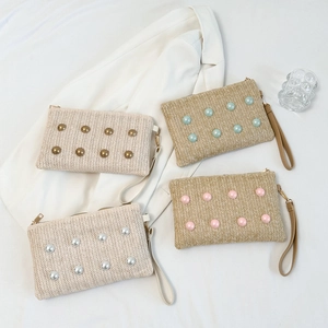 Fashionable woven straw clutch bag with colorful decorative beads for summer stylish women