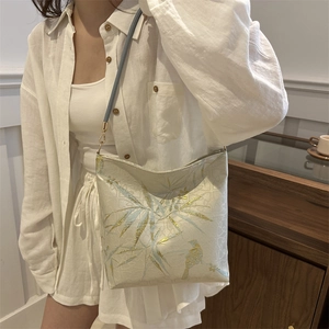 New Chinese style shoulder bag featuring elegant golden bamboo leaf embroidery and bird patterns