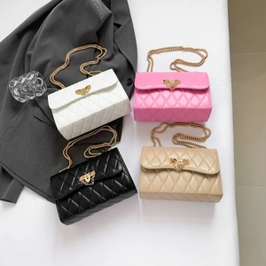 Chic quilted crossbody bags in four colors with gold chain straps for commuting fashion