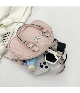 Internal view of pink bow bowling bag showing large capacity for phone and accessories
