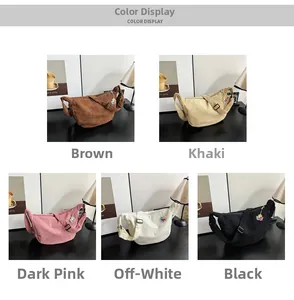Detail view of five corduroy crossbody bags in various colors with floral charms