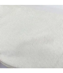 Close-up of white corduroy fabric texture with vertical ribbed patterns for casual tote bags