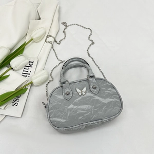 Gray pleated bowling bag with butterfly metallic charm and silver chain strap