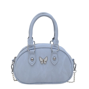 Light blue bowling bag with pleated texture and white butterfly metal accent