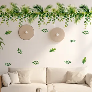 Detail of tropical palm leaves and vine wall stickers in hand-painted watercolor style