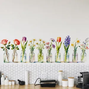 Detailed view of ten watercolor floral potted plant wall stickers on a clean white wall