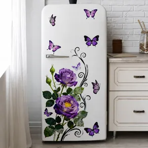 Detail of purple rose and butterfly wall stickers on a white vintage refrigerator