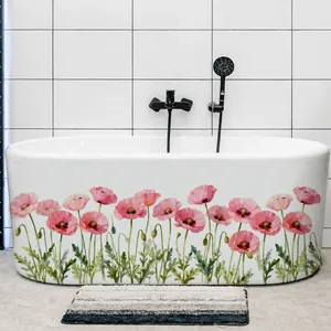 Close-up of pink poppy floral stickers applied on a white bathtub in a modern bathroom
