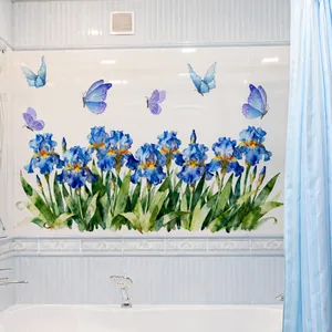 Detail showing blue iris flowers and butterflies stickers on a white bathroom wall tile
