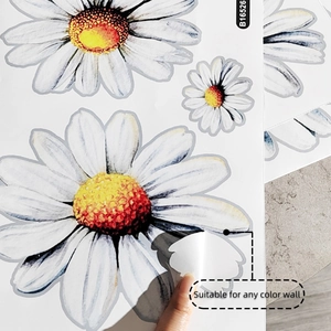 Detail of self-adhesive white daisy wall stickers showing peel-off texture and quality
