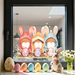Close-up of Easter gnome window decals with bunny ears on a glass pane in a cozy home setting