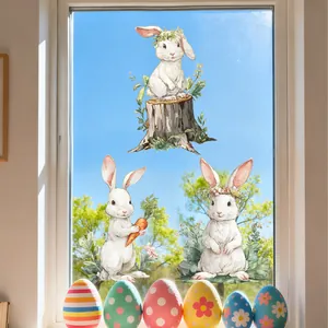 Detailed view of hand-painted Easter bunny static stickers on window glass
