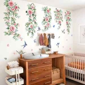 Pink rose vine wall decals with blue birds for a cozy nursery and bedroom decoration