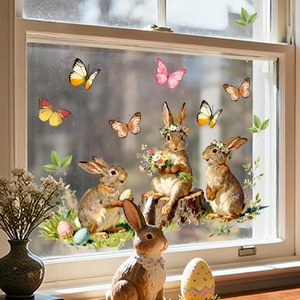 Detail of Easter bunny window stickers with watercolor eggs and butterflies on glass