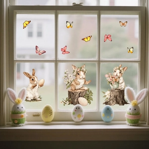Close-up of Easter bunny window stickers on a glass surface with floral egg patterns