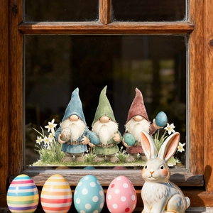 Detailed view of Easter gnomes and colorful eggs window stickers on a rustic wooden window