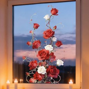 Detail of rose and heart static cling window stickers on glass with sunset background
