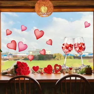 Detail showing Happy Valentine's Day heart stickers and wine glass on a glass window