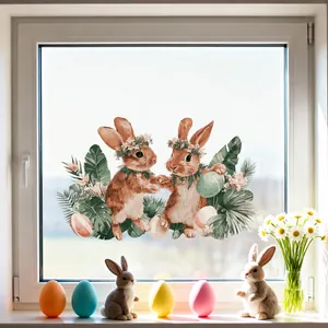 Close-up of Easter window stickers with cute bunny illustration and decorative floral eggs