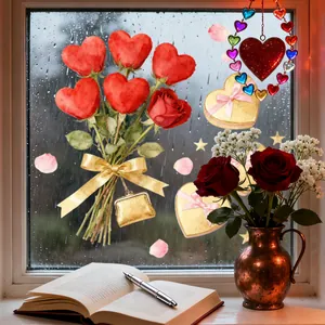 Watercolor Valentine's stickers with roses and hearts on a glass window during a rainy day