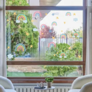 Detailed view of rainbow, stars, and clouds static window film on glass surface