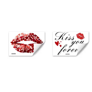 Detail view of pink heart lips and Kiss You Forever text Valentine's Day window stickers