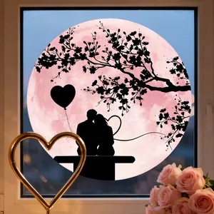 Detail of a pink moon window cling with romantic couple silhouette and heart balloons