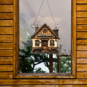 Flat 2D acrylic cottage ornament with Welcome text and silver chain on wood window
