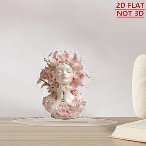 Flat acrylic standee of a floral girl with feather details on a wooden table desk