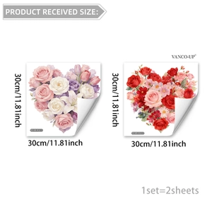 Detail of two floral heart window clings showing pink lilies and red roses on white background