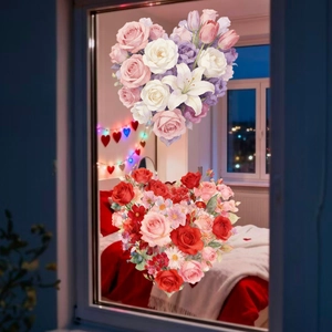 Detail of pink and red floral heart window decals on glass in a cozy bedroom setting