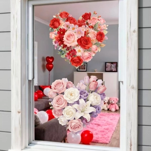Floral heart window clings with roses and lilies displayed on clean glass for Valentine decoration