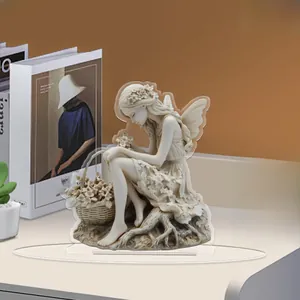 Detailed 2D flat acrylic floral girl ornament with base on a cozy wooden table setup