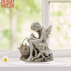 Detailed view of 2D flat acrylic fairy ornament with flower basket on a white windowsill