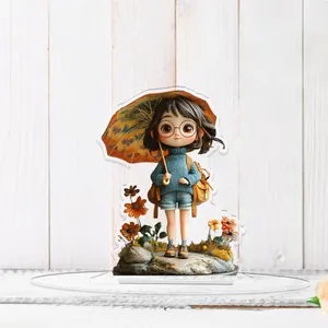 Flat 2D acrylic girl figurine with umbrella and backpack on wooden texture surface