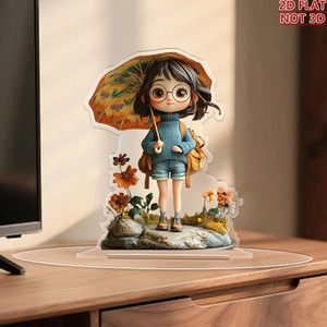 Detailed view of 2D flat acrylic ornament with cute girl and flower art on wooden desk