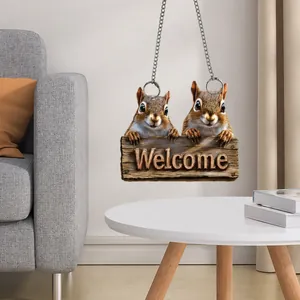 Detailed macro view of 2D flat acrylic Welcome sign featuring squirrels and metal chain
