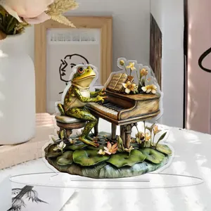 Detailed close-up of a 2D acrylic frog playing piano standee on a wooden table decoration