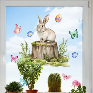 Easter window stickers featuring a watercolor bunny on a log with butterflies and eggs